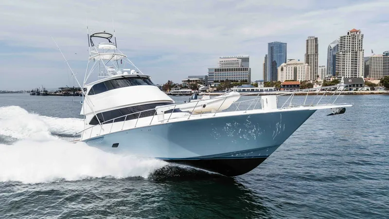 Slide: The Image of 2014 Viking 76 Enclosed Bridge "TRANQUILO" The Viking 76 Enclosed Bridge Sportfisher cuts through the water with grace and power, showcasing its sleek hull design and robust construction. The vessel's sharp bow and aerodynamic lines are complemented by the enclosed bridge, offering a commanding vi - 7962527