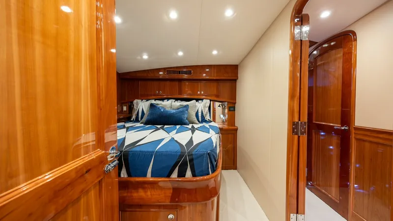 Slide: The Image of Luxurious Forward Stateroom This inviting forward stateroom on the 2008 Blue Angel by Winter Custom Yachts features exquisite wood finishes and ambient recessed lighting. The plush bedding and ample storage create a cozy yet functional space, perfect for restful nights at sea. The c - 7961714
