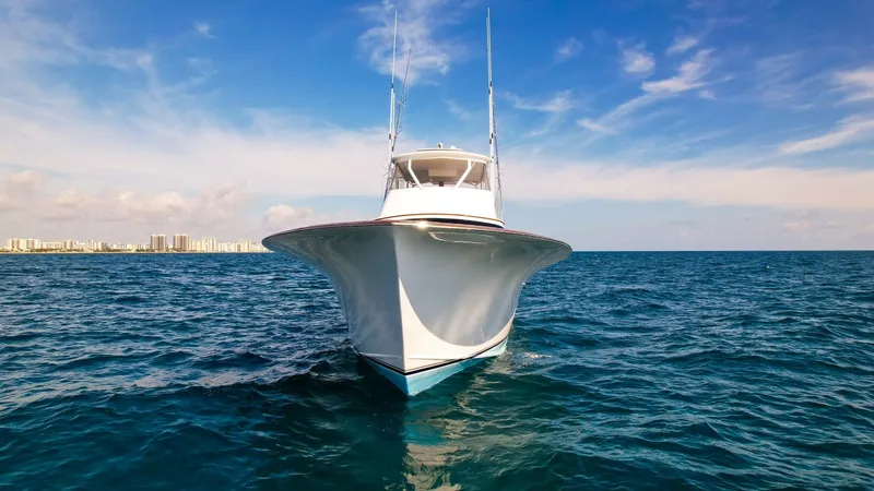 Slide: The Image of Bow View of Sportfish Yacht This striking front view of the Blue Angel, a 2008 Winter Custom Yachts 62 Sportfish, showcases its sleek and aerodynamic bow design. The sharp lines and pristine white finish highlight the vessel's elegance and performance capabilities. Ideal for sportfi - 7961725