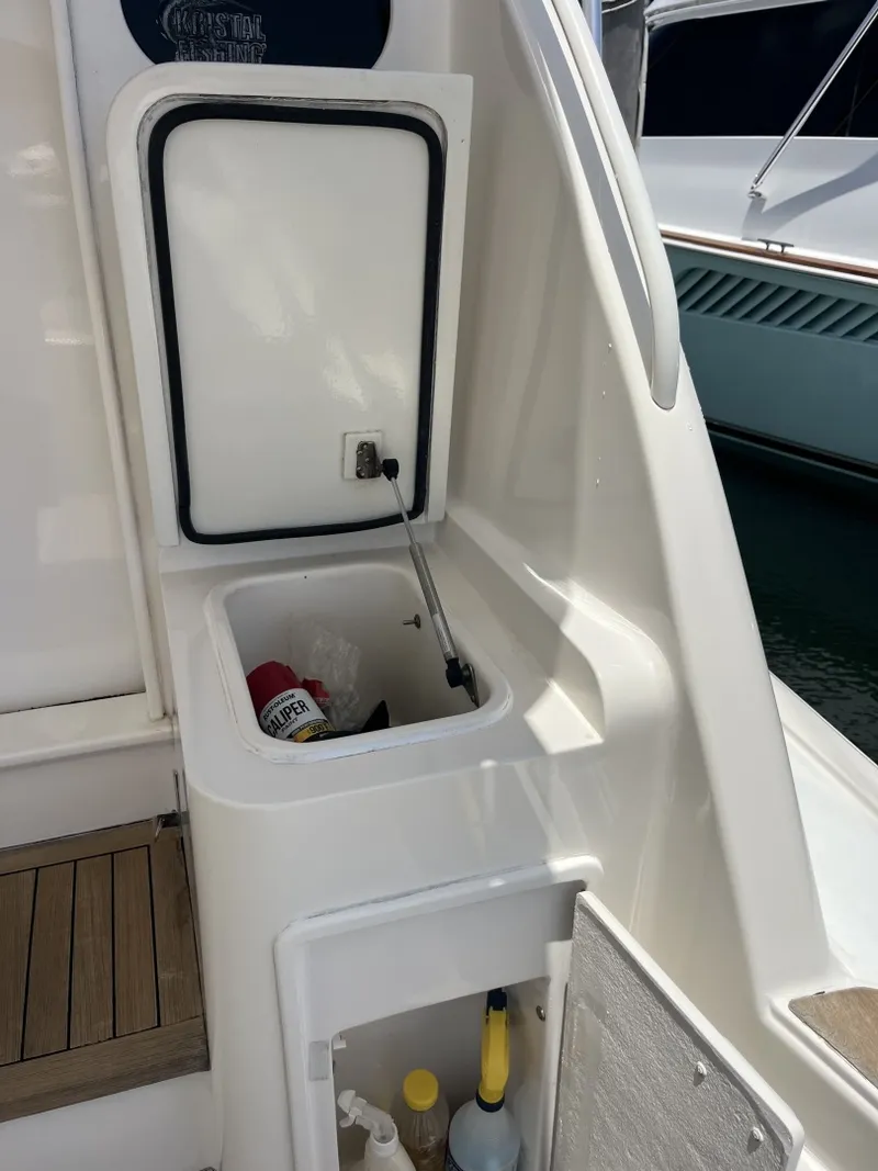 Slide: The Image of Cockpit Storage on the 2004 Ocean Yachts 52 Super Sport - 8036675