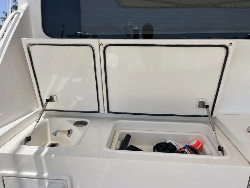 Slide: The Image of Cockpit Storage on the 2004 Ocean Yachts 52 Super Sport - 8036673