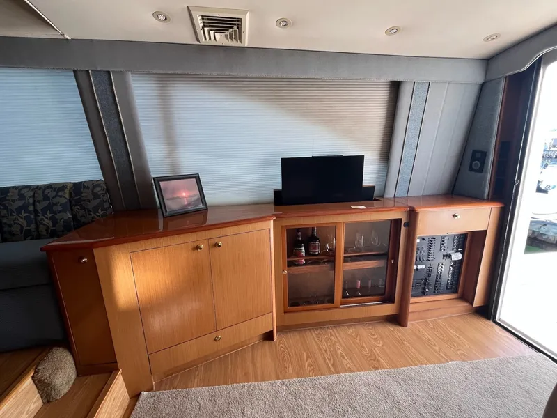 Slide: The Image of Entertainment center and bar storage on the 2004 Ocean Yachts 52 Super Sport - 8036707