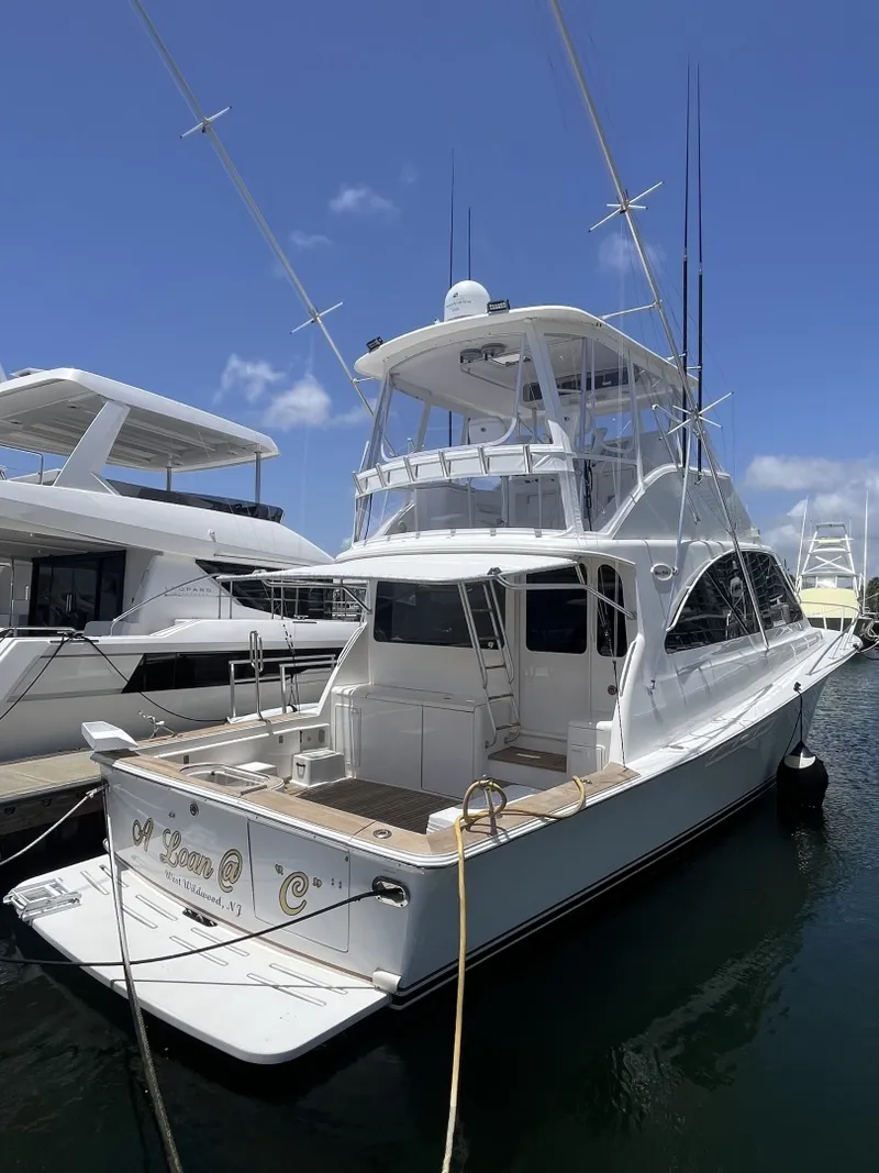 Slide: The Image of Aft view of the 2004 Ocean Yachts 52 Super Sport Docked at a marina - 8036661