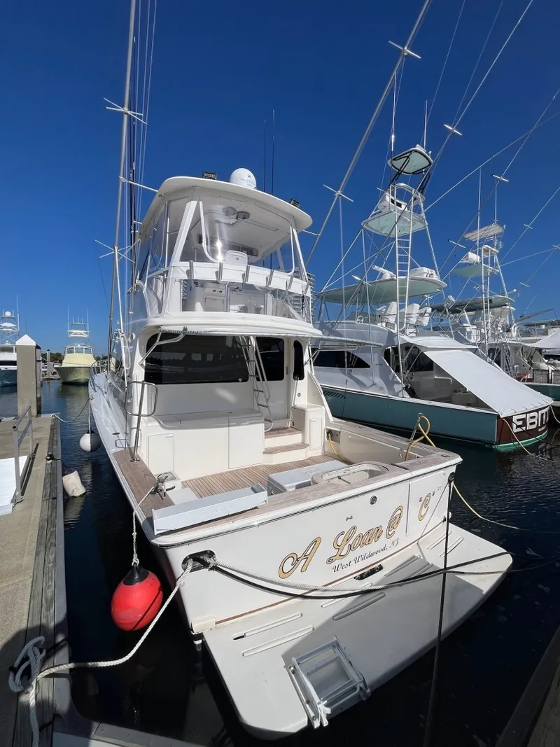 Slide: The Image of Aft view of the 2004 Ocean Yachts 52 Super Sport Docked at a marina - 8036688