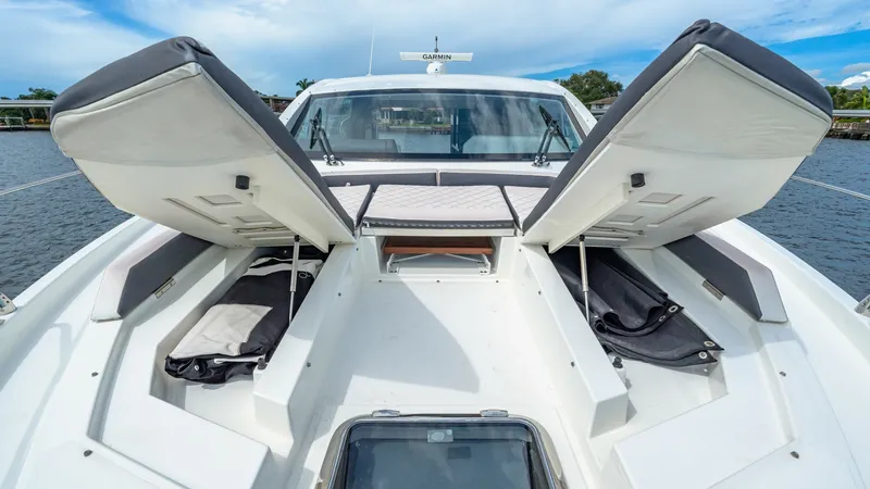 Slide: The Image of Foredeck with Sunpad Storage The foredeck of the 2019 Cruisers Yachts Cantius 46 features versatile sunpad storage, offering ample room for gear and accessories. The twin sunpad hatches open smoothly, providing easy access to the storage compartments beneath. This area is designed fo - 8141275