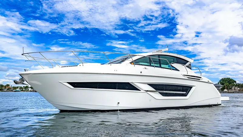 Slide: The Image of Starboard Profile of Serenity Cantius 46 The starboard profile of the 2019 Serenity Cantius 46 by Cruisers Yachts showcases its sleek, contemporary design and dynamic lines. Large windows accentuate the hull, providing ample natural light to the interior and enhancing visibility. The vessel's ae - 8141293