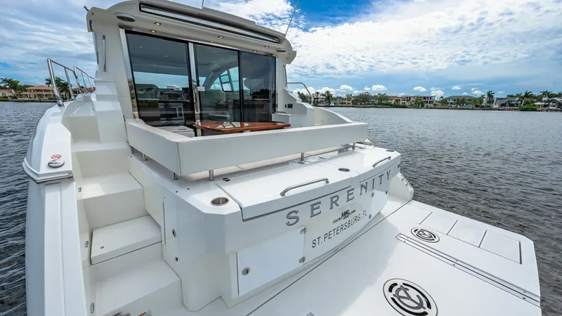 Slide: The Image of Aft Deck and Swim Platform The aft deck of the 2019 Cruisers Yachts Cantius 46 offers a spacious area for relaxation with convenient access to the water via the swim platform. Featuring sleek lines and modern finishes, this area is perfect for entertaining. The large sliding glass - 8141259