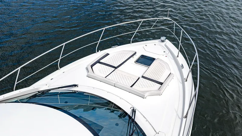 Slide: The Image of Foredeck with Sunpad Loungers The foredeck of the 2019 Cantius 46 by Cruisers Yachts features plush sunpad loungers, perfect for relaxing and enjoying the sea breeze. The sleek railings and integrated hatch add to the elegant design while ensuring safety and functionality. This area p - 8141283
