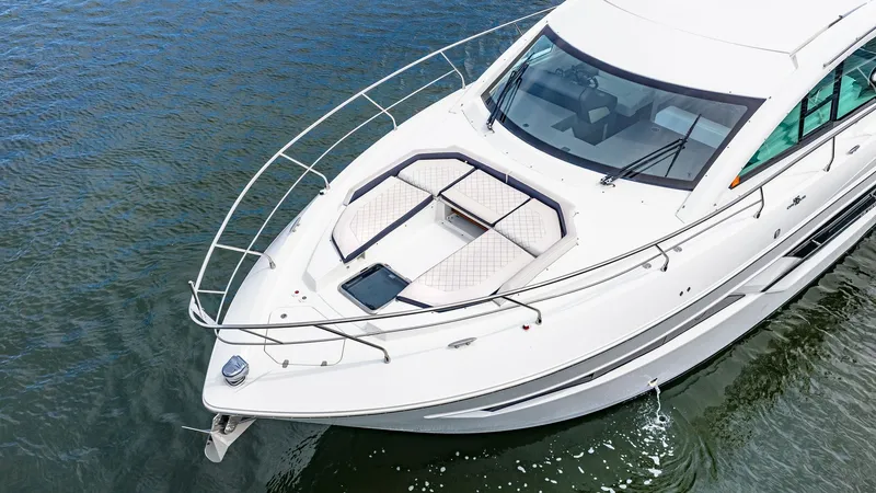 Slide: The Image of Spacious Foredeck with Sun Pads The foredeck of the 2019 Cruisers Yachts Cantius 46 offers luxurious sun pads, perfect for relaxation while enjoying panoramic views. The sleek lines and modern design enhance both functionality and aesthetics. Stainless steel railings provide safety and - 8141296