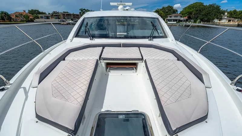 Slide: The Image of Bow Sunpad Area with Cushions The bow of the 2019 Cruisers Yachts Cantius 46 features a luxurious sunpad area, perfect for relaxation. The quilted cushions provide comfort and style, set against the backdrop of sleek stainless steel rails. Enjoy unobstructed views and ample space for - 8141273