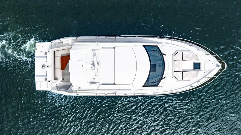 Slide: The Image of Aerial View of Cantius 46 Deck This aerial shot highlights the sleek design of the 2019 Cantius 46 by Cruisers Yachts. The spacious aft deck is perfect for social gatherings, while the sunpad on the bow provides an ideal spot for relaxation. The modern lines and luxurious layout are ev - 8141285