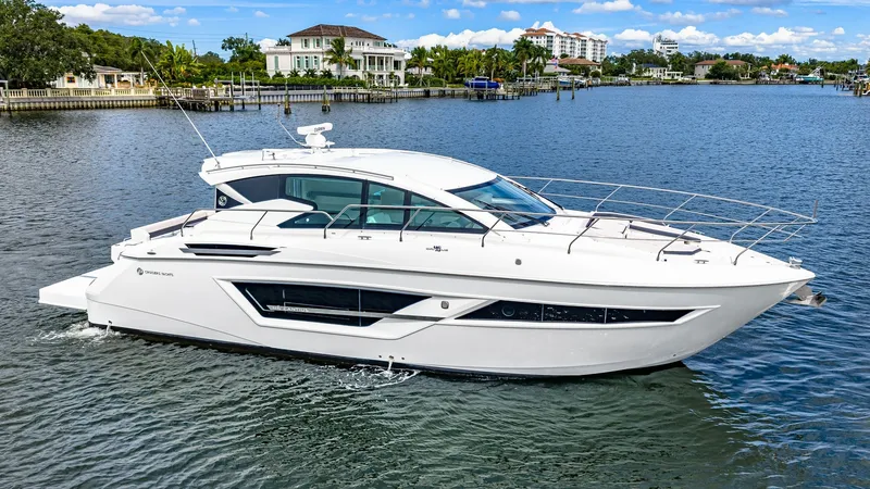 Slide: The Image of Starboard Profile of Cantius 46 The 2019 Cantius 46 by Cruisers Yachts showcases a sleek and modern starboard profile. With its expansive windows and aerodynamic design, this vessel offers panoramic views and a luxurious cruising experience. The elegant lines and contemporary styling ma - 8141289