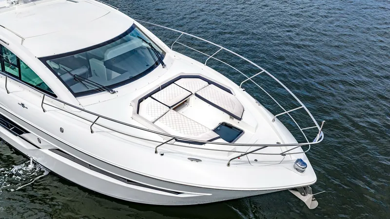 Slide: The Image of Forward Deck with Sun Lounge The forward deck of the 2019 Serenity Cantius 46 showcases a spacious sun lounge, perfect for relaxation and enjoying panoramic ocean views. The sleek design is complemented by sturdy stainless steel railings, ensuring safety and style. This area offers a - 8141282