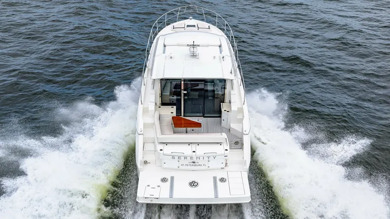Slide: The Image of Aft View with Swim Platform The 2019 Serenity by Cruisers Yachts showcases a sleek aft view, emphasizing its spacious swim platform and elegant lines. The Cantius 46 model offers a seamless connection between the aft deck and interior, ideal for entertaining and enjoying the open wa - 8141310