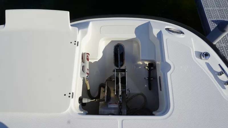 Slide: The Image of Anchor Locker with Hatch Open This image showcases the anchor locker of the 2016 Boston Whaler 270 Dauntless, with the hatch open for easy access. The spacious compartment is designed to securely store the anchor and associated gear, featuring a clean and organized layout. The durable - 8087577