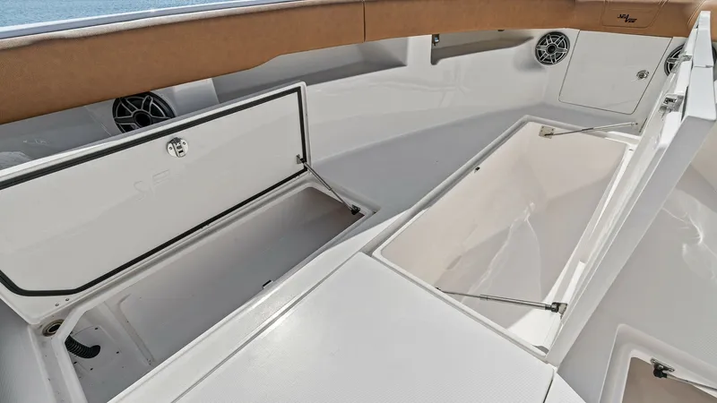 Slide: The Image of Spacious Forward Deck Storage The 2024 SeaVee 340B's forward deck features ample storage compartments, perfect for stowing gear and essentials. The sleek design is complemented by high-quality finishes and durable materials. This area offers convenience and functionality, making it id - 8398200