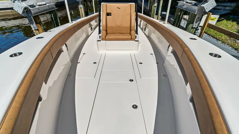 Slide: The Image of Spacious Forward Seating Area The 2024 SeaVee 340B offers a well-appointed forward seating area with plush, tan cushioning for comfort. The sleek design features ample space for relaxation or socializing, complemented by high-quality materials and a durable finish. This area is ideal - 8398193