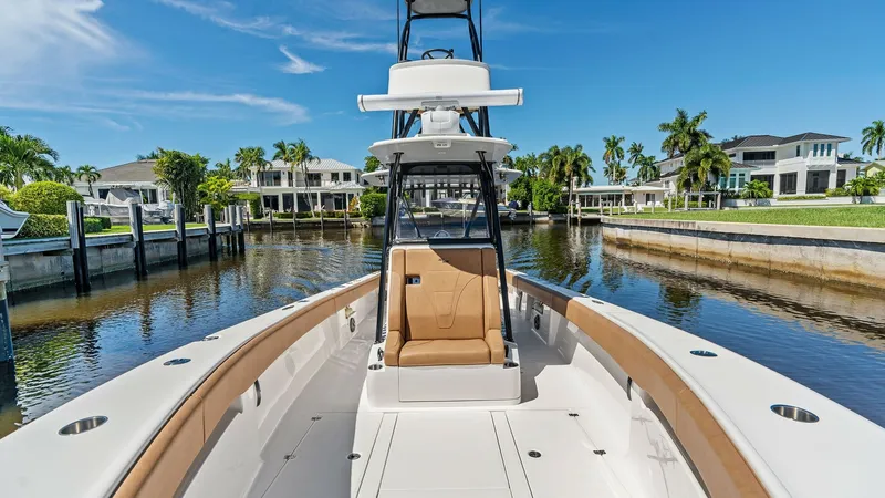 Slide: The Image of Spacious Bow Area with Seating The 2024 SeaVee 340B showcases a spacious bow area featuring comfortable tan cushioned seating. The clean, white deck and ample walk-around space make it ideal for relaxation and socializing. Enjoy picturesque views and easy access, perfect for both leisu - 8398180