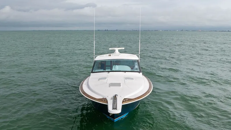 Slide: The Image of Bow View of Hatteras GT45X The sleek bow of the 2017 Hatteras GT45X, SEA'N ME TOO, cuts through the water with precision. The clean lines and robust design showcase the vessel's superior craftsmanship and performance capabilities. This powerful front angle highlights the yacht's re - 8439521