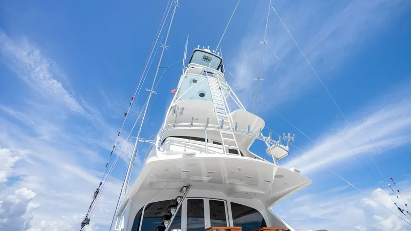 Slide: The Image of Tower and Aft Deck View This image showcases the impressive tower of the 2017 Viking 92 Enclosed Bridge, Double Barrel. The sturdy tower provides excellent visibility, ideal for spotting fish or navigating open waters. Below, the aft deck features comfortable seating and rod hol - 8439639