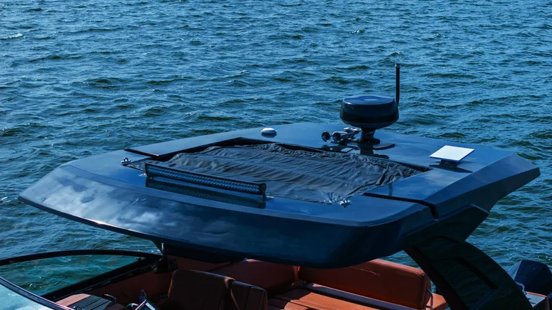 Slide: The Image of Hardtop with Integrated Radar This image showcases the sleek hardtop of the 2022 Cruisers Yachts 34 GLS, featuring an integrated radar system. The hardtop provides shade and protection while maintaining a stylish profile. Its modern design enhances the yacht's aesthetic while offering - 8398540