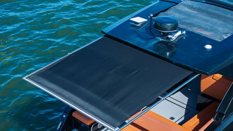 Slide: The Image of Retractable Sunshade and Seating Area This image showcases the retractable sunshade of the 2022 Cruisers Yachts 34 GLS, providing ample shade for the luxurious seating area below. The sleek, modern design is complemented by sophisticated materials and finishes, ensuring both comfort and style - 8398541