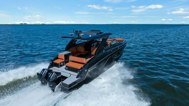 Slide: The Image of Aft Deck with Twin Engines The 2022 Cruisers Yachts 34 GLS showcases a sleek aft deck equipped with powerful twin outboard engines, ensuring a thrilling performance on the water. The spacious seating area features luxurious upholstery, providing comfort and style for passengers. Wi - 8398548