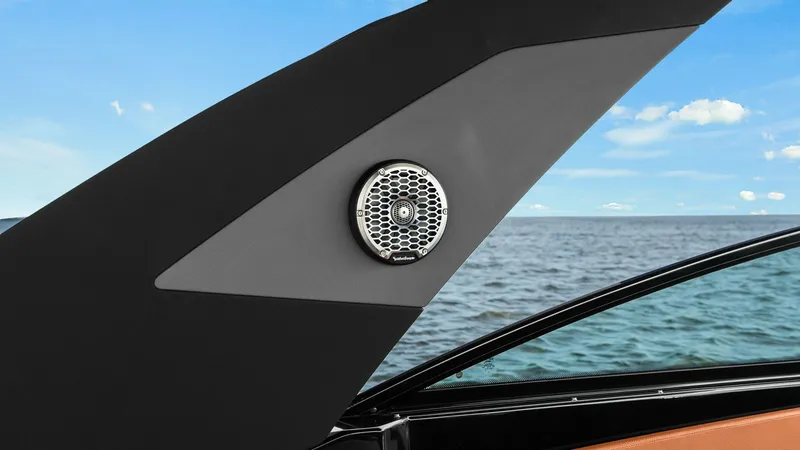 Slide: The Image of Exterior Audio System Detail This image showcases the sleek exterior audio system on the 2022 Cruisers Yachts 34 GLS. The speaker is integrated seamlessly into the yacht's modern design, providing high-quality sound for an enhanced onboard experience. The backdrop of open water highl - 8398529