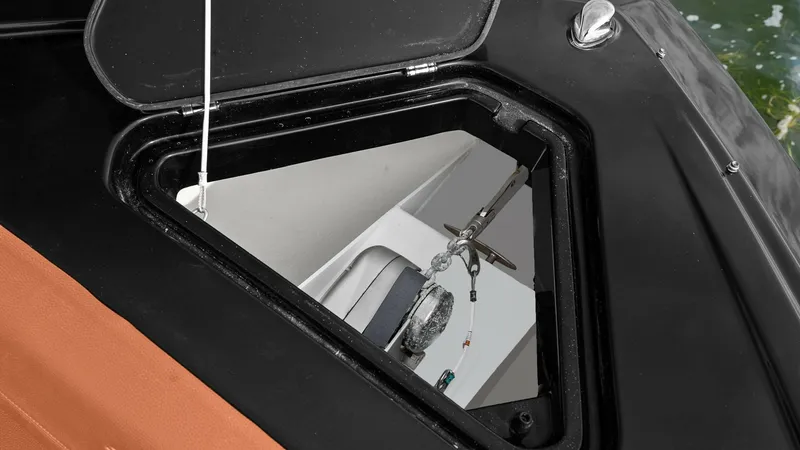 Slide: The Image of Anchor Locker Access Hatch This image showcases the anchor locker access hatch on the 2022 Cruisers Yachts 34 GLS. The hatch is seamlessly integrated into the deck, providing easy access to the anchor mechanism. The surrounding area features durable, weather-resistant materials, en - 8398527
