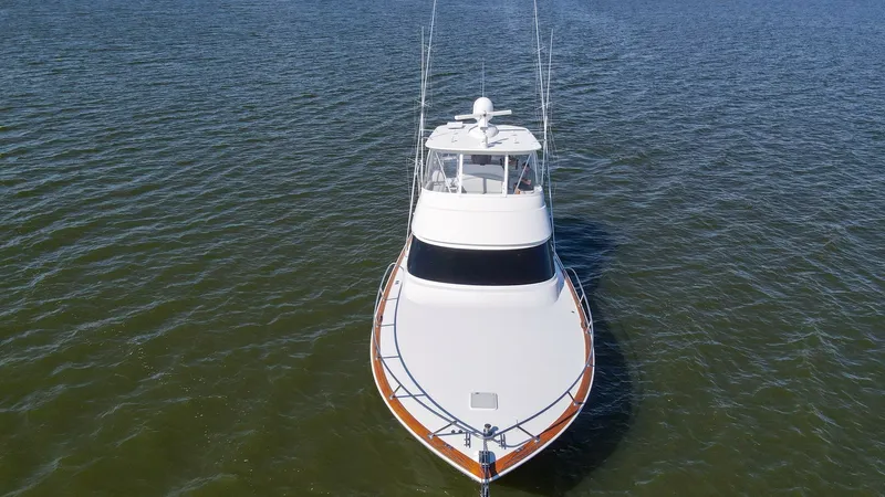 Slide: The Image of Bow View with Flybridge This striking bow view of the 2024 Viking 54 Convertible, Nomad, showcases its sleek design and robust build. The spacious foredeck is complemented by a well-equipped flybridge, offering excellent visibility and control. The elegant lines and quality craf - 8439838