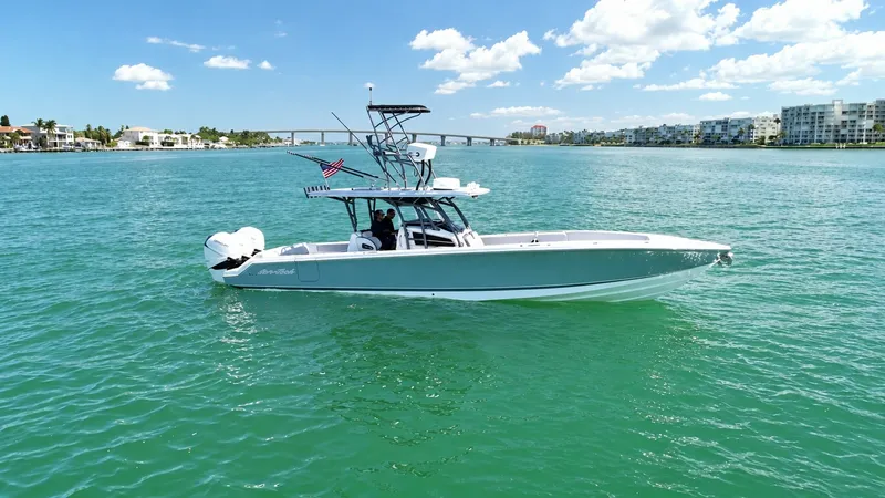 The Image of Side Profile of Nor-Tech 390 Sport The Nor-Tech 390 Sport, named 'My Mermaid', showcases sleek lines and a sporty profile, cutting through the water with ease. This 2020 model features a robust hull and modern design, complemented by powerful outboard engines for enhanced performance. The - 8521454