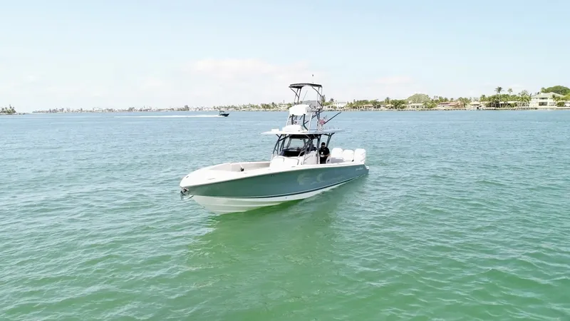 Slide: The Image of Bow View of Nor-Tech 390 Sport This image showcases the sleek bow of the 2020 Nor-Tech 390 Sport, highlighting its streamlined design and robust construction. The vessel features a spacious center console and a custom T-top, designed for optimal visibility and comfort. Its elegant prof - 8521468