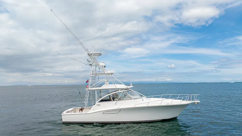 The Image of Side Profile of Cabo 40 Express The Cabo 40 Express 'Knot Working' showcases a sleek and robust design, ideal for both leisure and sport fishing. Its elegant white hull and streamlined superstructure are complemented by a sturdy tuna tower, providing excellent visibility and functionali - 8511583