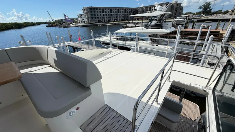 Slide: The Image of Spacious Flybridge Lounge Area The flybridge of the Absolute Navetta 58 features a spacious lounge area with comfortable seating and ample deck space. Surrounded by sleek railings, it offers panoramic views ideal for relaxation and entertainment. The high-quality finishes and thoughtfu - 8640148