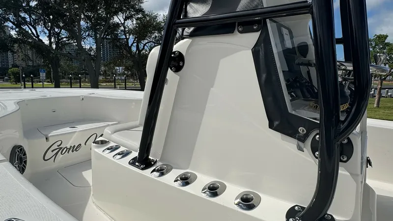 Slide: The Image of Center Console and Rod Holders The image showcases the sleek and functional center console of the 2023 SeaVee 270Z. Equipped with multiple rod holders, the console is designed for both convenience and efficiency, catering to serious anglers. The glossy finish and robust construction ar - 8398125