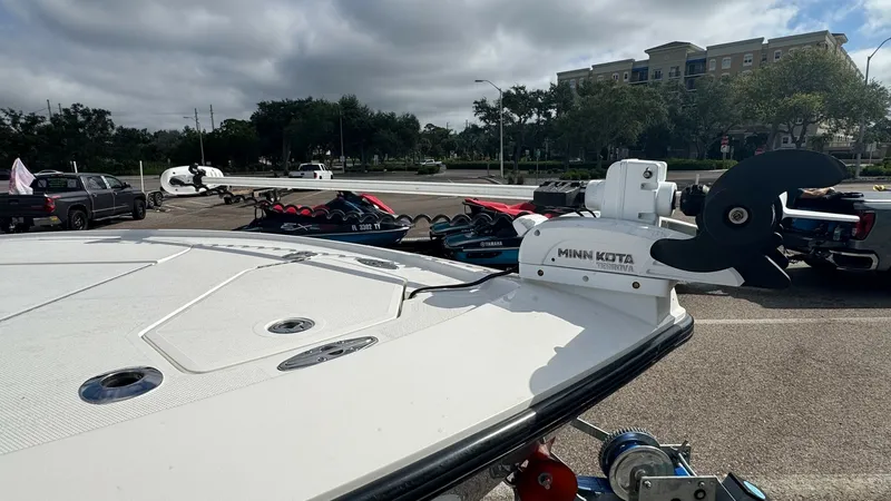 Slide: The Image of Bow Deck with Trolling Motor The image features the bow deck of the 2023 SeaVee 270Z, showcasing its spacious and functional layout. Equipped with a Minn Kota trolling motor, the deck is designed for optimal maneuverability and control during fishing expeditions. The sleek, modern de - 8398127