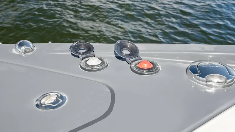 Slide: The Image of Fuel and Water Fill Caps This image showcases the neatly arranged fuel and water fill caps on the deck of the 2023 Cruisers Yachts 42 GLS. The polished, stainless steel caps are easily accessible, ensuring effortless refueling and water replenishment. Their strategic placement on - 8619146