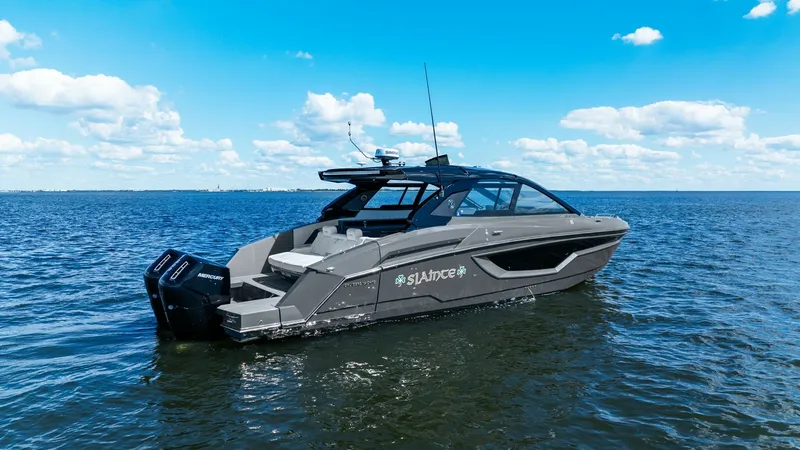 Slide: The Image of Aft View with Engine and Swim Platform This image showcases the sleek aft design of the 2023 Cruisers Yachts 42 GLS. The vessel features a spacious swim platform, offering easy access to the water and a comfortable area for relaxation. Equipped with powerful dual outboard engines, the yacht pr - 8619165