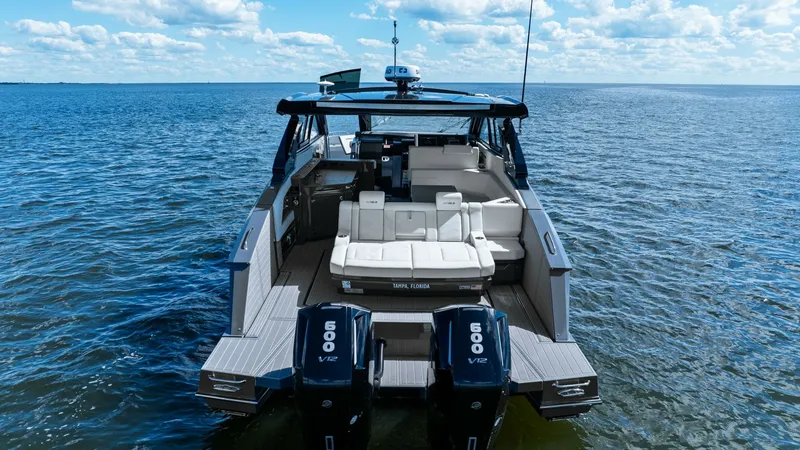 Slide: The Image of Stern View with Twin Engines The 2023 Cruisers Yachts 42 GLS showcases a sleek stern design with powerful twin 600 V12 engines, ideal for high-performance cruising. The spacious aft deck features plush seating, perfect for relaxation and entertaining while enjoying panoramic ocean vi - 8619168