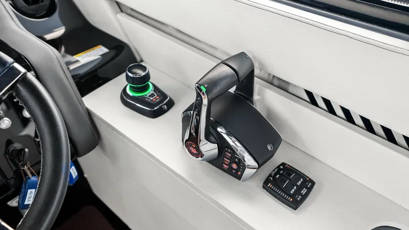 Slide: The Image of Helm Station Throttle Controls The helm station of the 2023 Cruisers Yachts 42 GLS showcases state-of-the-art throttle controls. Sleek and modern, the controls are designed for precision handling, featuring intuitive joystick steering for effortless maneuverability. The high-quality ma - 8619130