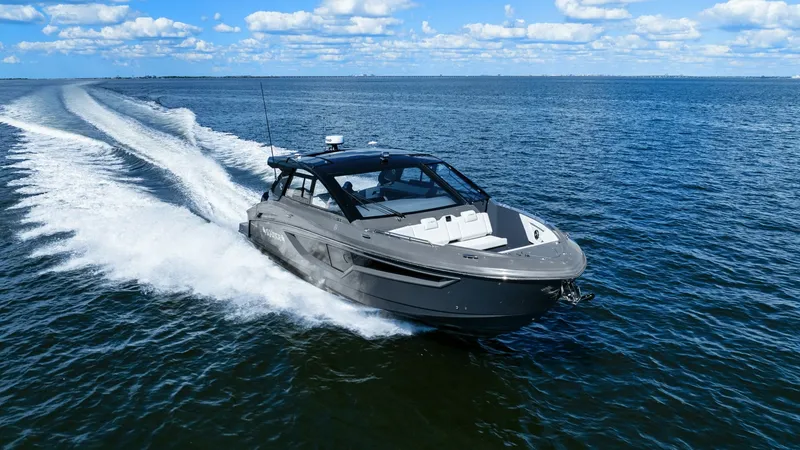 Slide: The Image of Dynamic Bow View in Motion The 2023 Cruisers Yachts 42 GLS showcases its sleek design as it glides effortlessly across the water. The bow features a spacious seating area, perfect for relaxation while enjoying panoramic ocean views. Its modern lines and cutting-edge hull design ens - 8619176