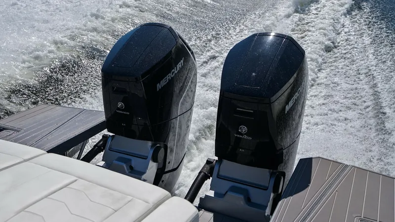 Slide: The Image of Twin Outboard Engines in Action The image showcases the powerful twin outboard engines of the 2023 Cruisers Yachts 42 GLS, propelling the vessel with impressive speed and agility. The sleek design of the engines complements the modern aesthetics of the yacht, while the wake illustrates - 8619160