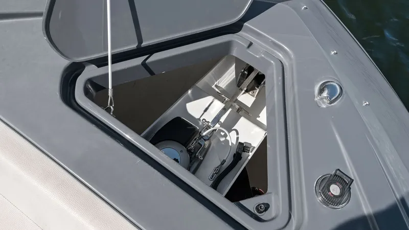 Slide: The Image of Bow Anchor Locker Access This image showcases the bow anchor locker of the 2023 Cruisers Yachts 42 GLS. The locker is neatly integrated into the deck, providing easy access to the anchor mechanism and storage space. The design ensures functionality and safety, with a durable hatc - 8619145