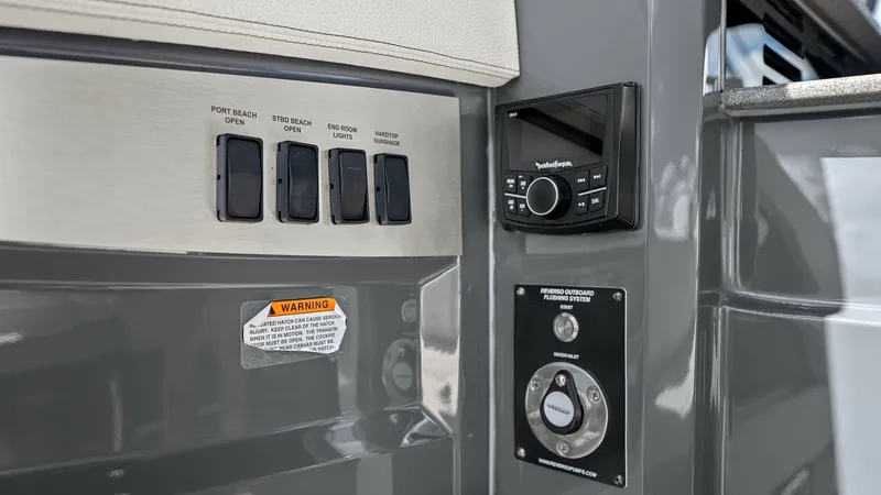 Slide: The Image of Control Panel and Audio System This image showcases the sleek control panel and integrated audio system on the 2023 Cruisers Yachts 42 GLS. The panel features easy-access switches for essential functions, ensuring smooth operation while on the water. The modern design is complemented b - 8619136