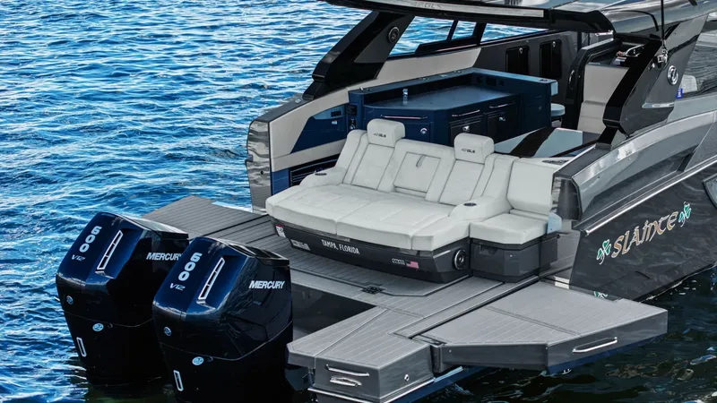 Slide: The Image of Aft Deck with Sun Lounge Seating The 2023 Cruisers Yachts 42 GLS showcases a stylish aft deck featuring luxurious sun lounge seating. This area provides ample space for relaxation with plush cushions and a sleek, modern design. The twin Mercury 600 outboards offer powerful performance, m - 8619166