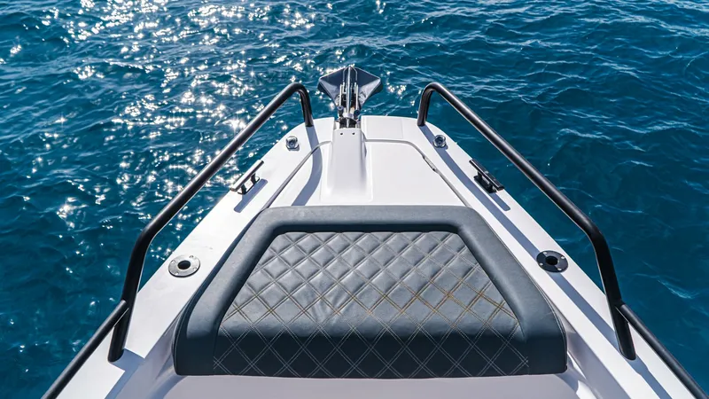 Slide: The Image of Bow Seating with Diamond Stitching The bow of the Axopar 37 Barbus features elegant seating with diamond-pattern stitching, offering both comfort and style. This area is perfect for relaxing while enjoying panoramic views of the water. The sturdy railings provide safety and support, making - 8439364