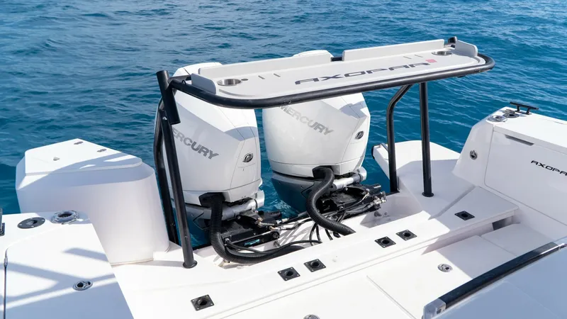Slide: The Image of Twin Mercury Outboard Engines The Axopar 37 Barbus features powerful twin Mercury outboard engines, offering impressive performance and reliability for any adventure on the water. The sleek design of the engine mount area provides easy access for maintenance, while the integrated rail - 8439367
