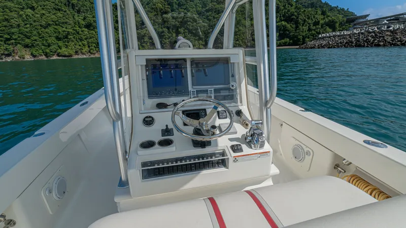 Slide: The Image of Helm Station with Electronics The helm station of the 2013 SeaVee 32 'Poco Mas' features state-of-the-art electronics, including dual display screens for navigation and monitoring. The sleek steering wheel is complemented by easy-to-access controls, making this area both functional an - 8738098