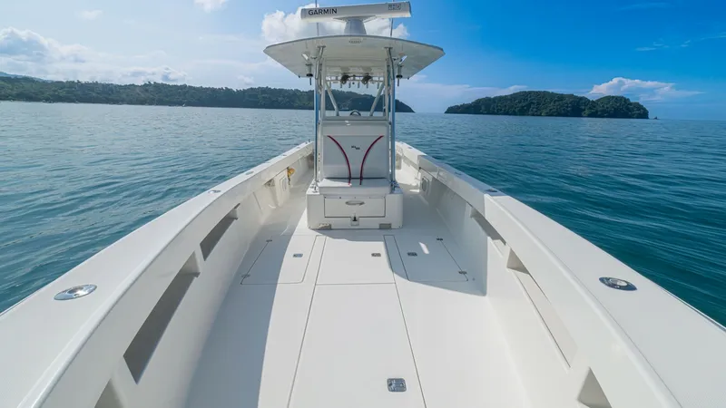 Slide: The Image of Spacious Forward Deck with T-Top The 2013 SeaVee Model 32, Poco Mas, showcases a spacious forward deck designed for both functionality and style. The sleek, non-slip surface ensures safety and comfort, while the robust T-Top provides ample shade and protection from the elements. Perfect - 8738101
