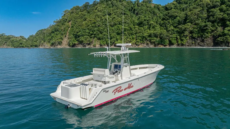 Slide: The Image of Aft Deck and Helm View This 2013 SeaVee 32 'Poco Mas' showcases a spacious aft deck, perfect for fishing or leisure activities. The helm is equipped with advanced navigation systems, providing excellent visibility and control. The vessel's sleek design and sturdy T-top offer bo - 8738110